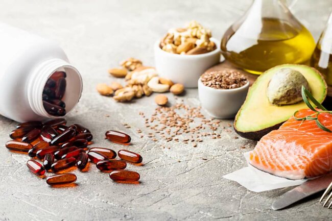 Healthy fats in nutrition – salmon, avocado, oil, nuts. Concept of healthy food discover the benefits and differences about nutraceuticals and functional foods